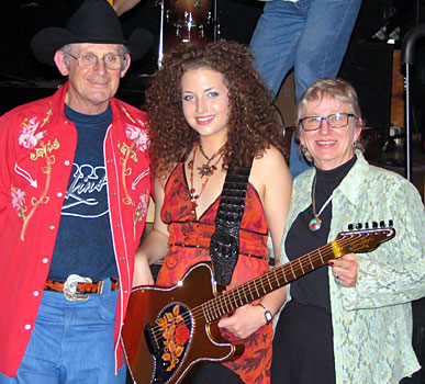 Allan and Barbara Tomkins with Briana Lee (centre)