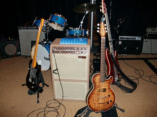 Acoustic/Electric Tomkins Guitar at front 