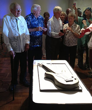 Geoff and friends with the cake