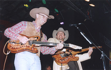 Jake Kelly and Gary Allan playing their Tomkins guitars