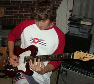 Smokin' Joe Robinson playing his Tomkins guitar